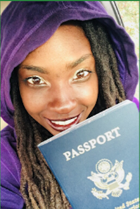 Darciea Houston in Purple Jacket holding a passport